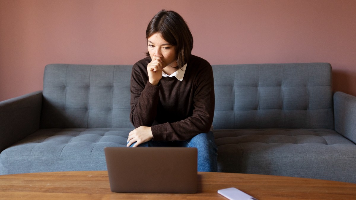 anxious-woman-sitting-couch.jpg